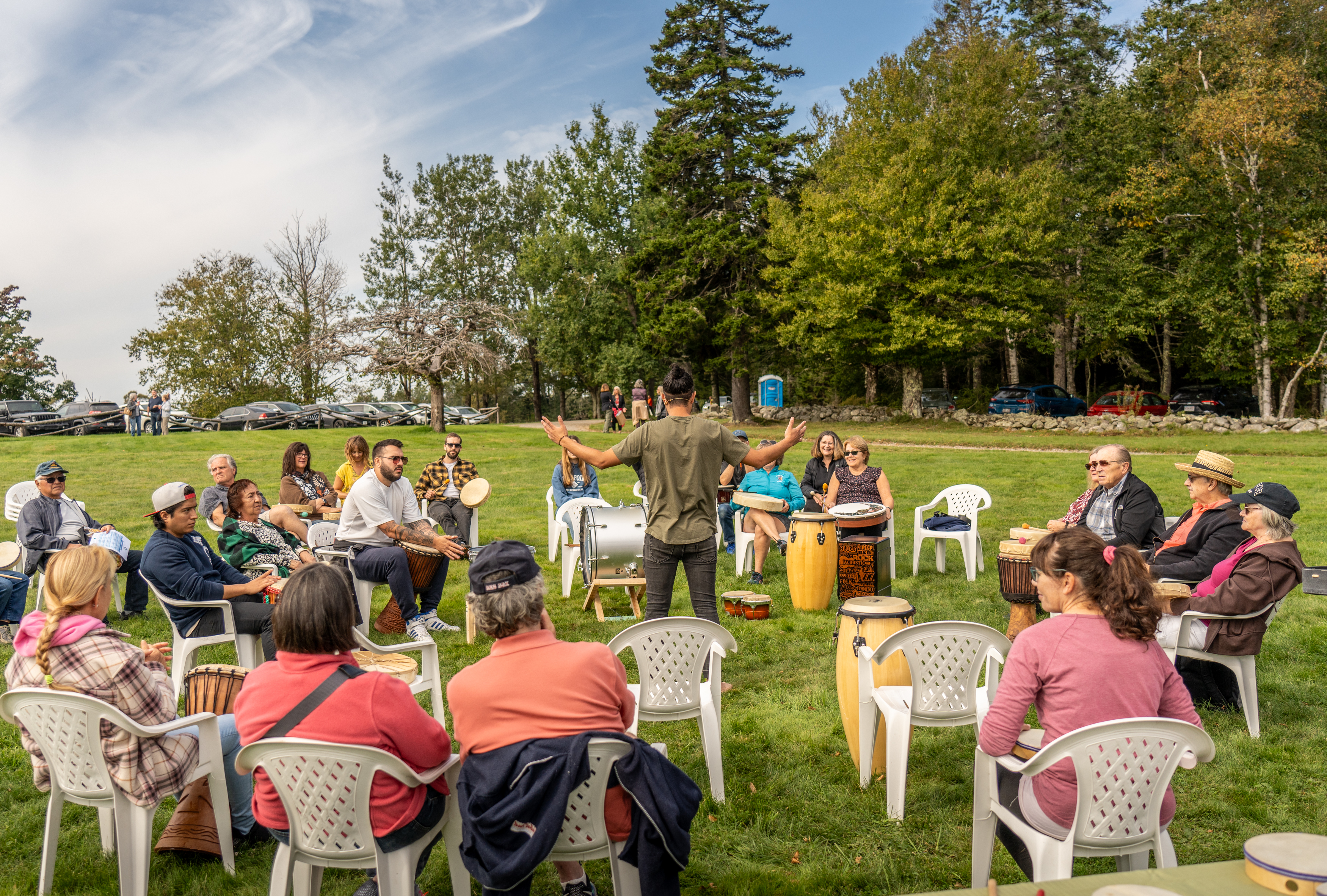 Facilitated drum circle workshop with engaged participants